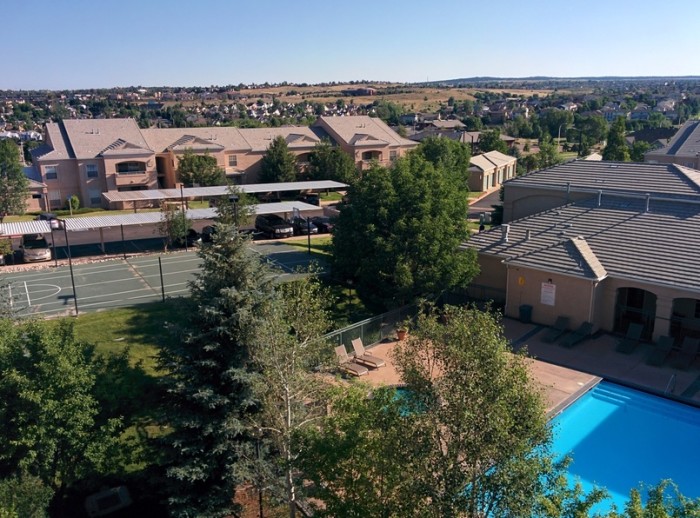 View from ridge looking out over basketball court and pool at Pine Bluffs